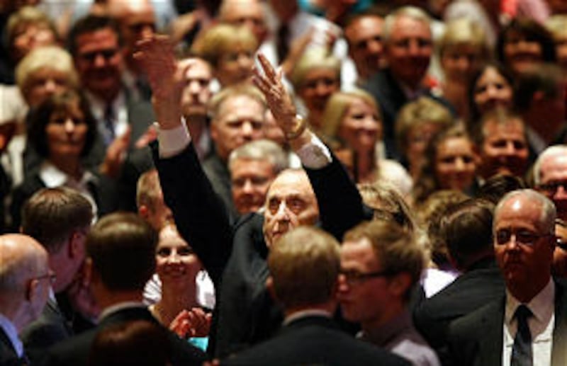 President Thomas S. Monson waves to the crowd after Golden Days, A Celebration of Life, in honor of