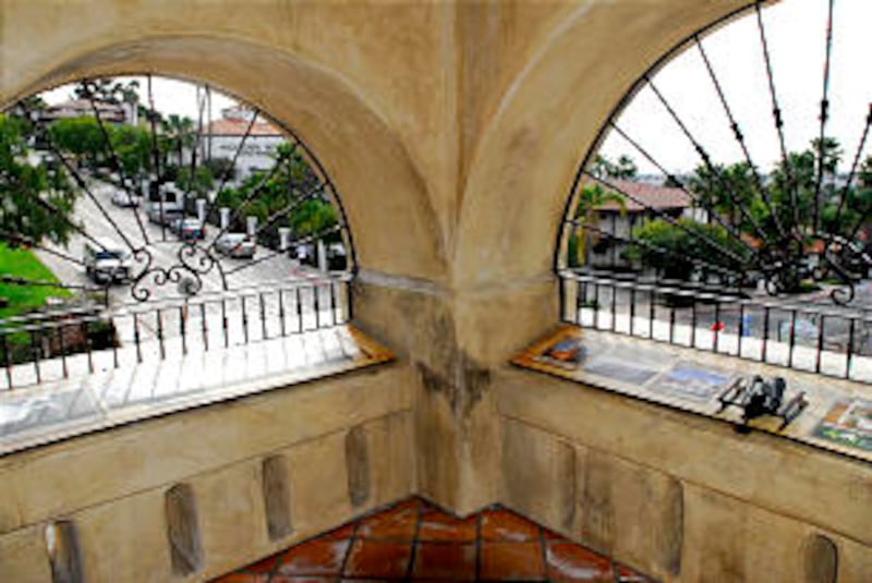 Arched windows from atop the watchtower give aerial view of San Diego Old Town. Interpretive panels