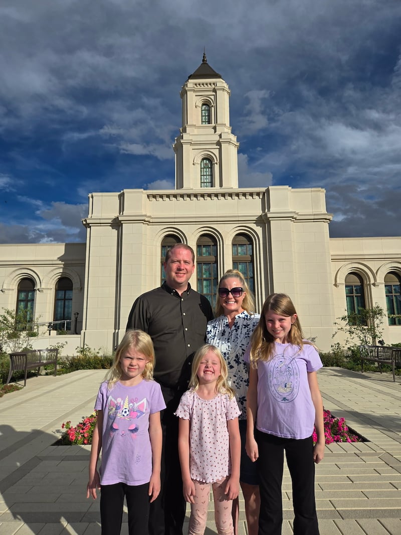 Luke Hopkin, back left, and his wife, Sara Hopkin, stand with their daughters Kapree, Violet and Alyce Hopkin outside the Cody Wyoming Temple in 2026.