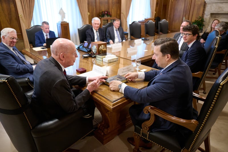 President Henry B. Eyring, first counselor in the First Presidency, presents a hardcover Book of Mormon to Miloslav Stašek, ambassador of the Czech Republic to the United States, during a visit in the Church Administration Building in Salt Lake City on Tuesday, April 28, 2026.