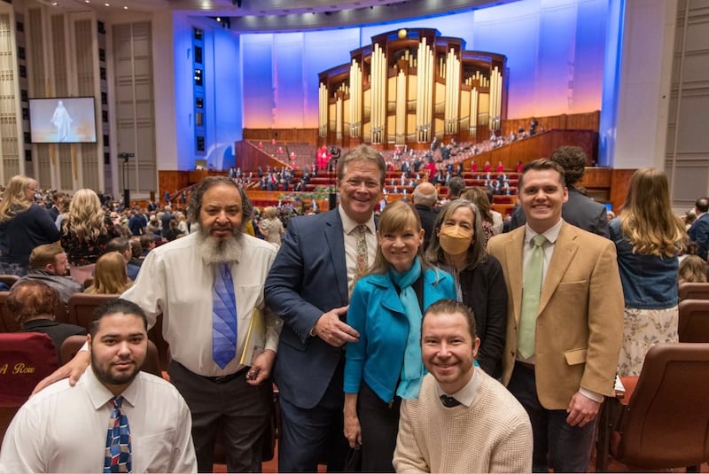 Andrea Brett smiles with friends and family at the Conference Center in Salt Lake City on April 6, 2025.