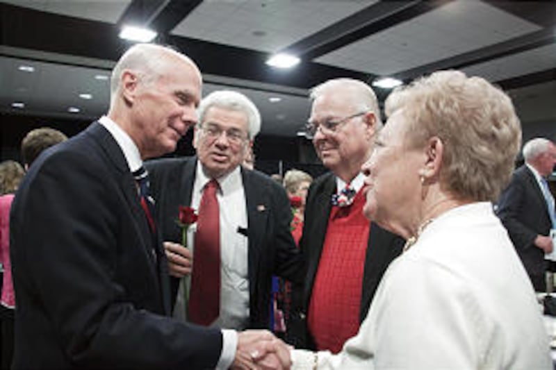 Alexander Doniphan Award recipient Elder Lance B. Wickman shakes hands with notable members of the c