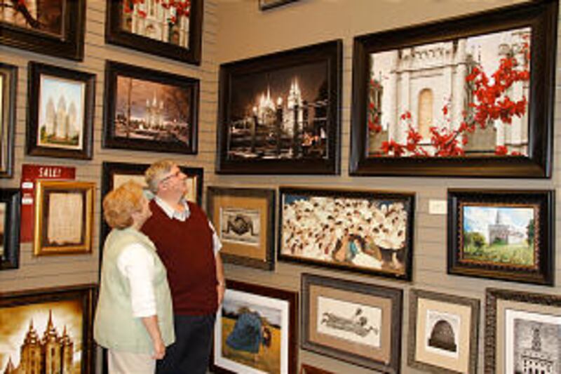 Norbert and Heidi Schmidt inspect artwork at the new Deseret Book flagship store in downtown Salt La