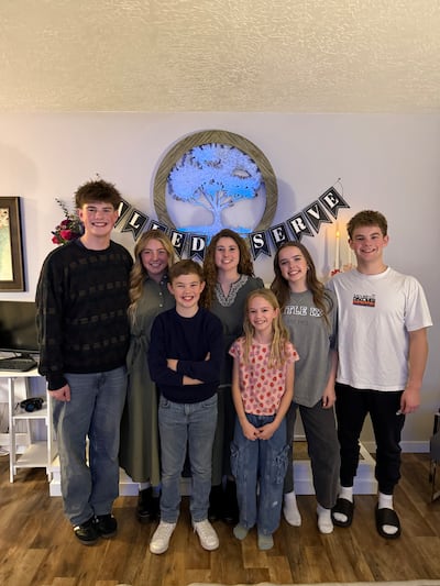 The Reid family children, left to right, after oldest daughters Isabel and Elle opened their mission calls: Eli, Elle, Mark, Isabel, Sarah Jane, Reina and Isaac Reid.