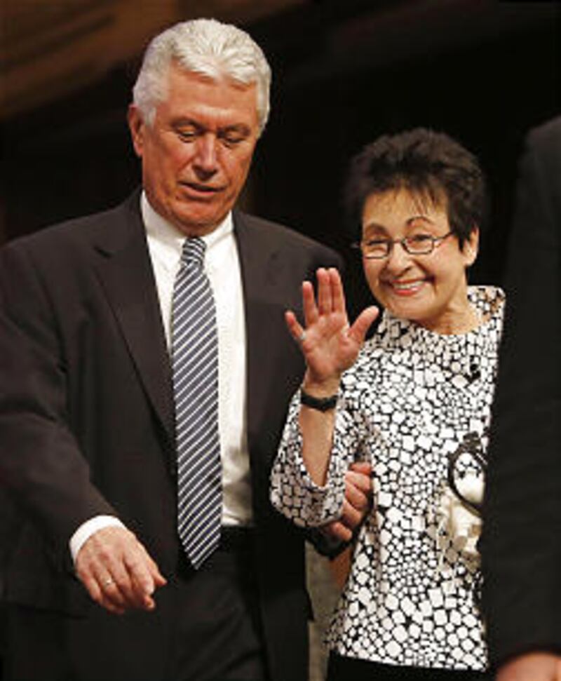 President Dieter F. Uchtdorf and Sister Harriet Uchtdorf walk onto the stand prior to speaking Sunda
