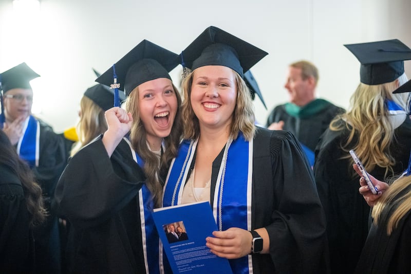 Graduates pose for photos outside the BYU–I Center following commencement on Thursday, July 23, 2026, in Rexburg, Idaho.