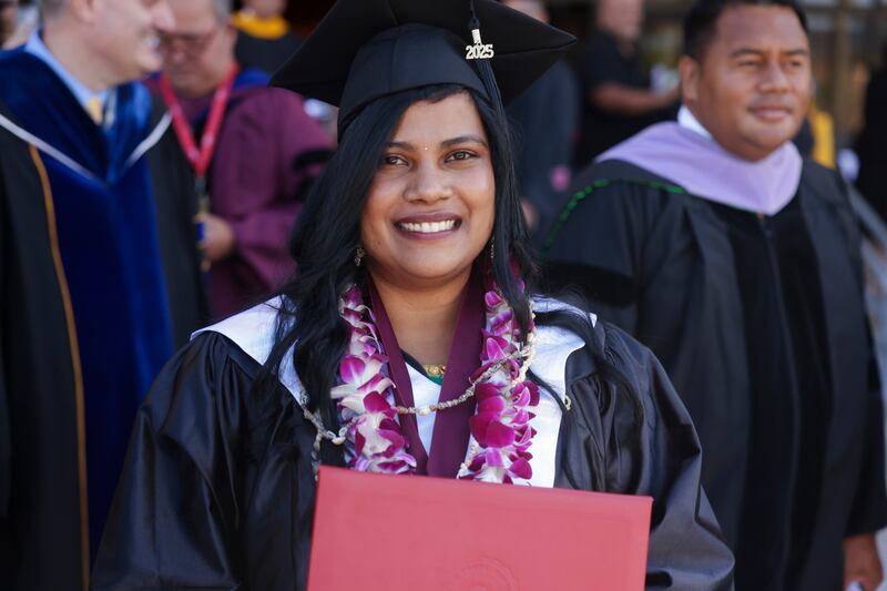 BYU–Hawaii graduates celebrate with family and friends outside the Cannon Activities Center in Laie, Hawaii, following commencement on Friday, Dec. 12, 2025.