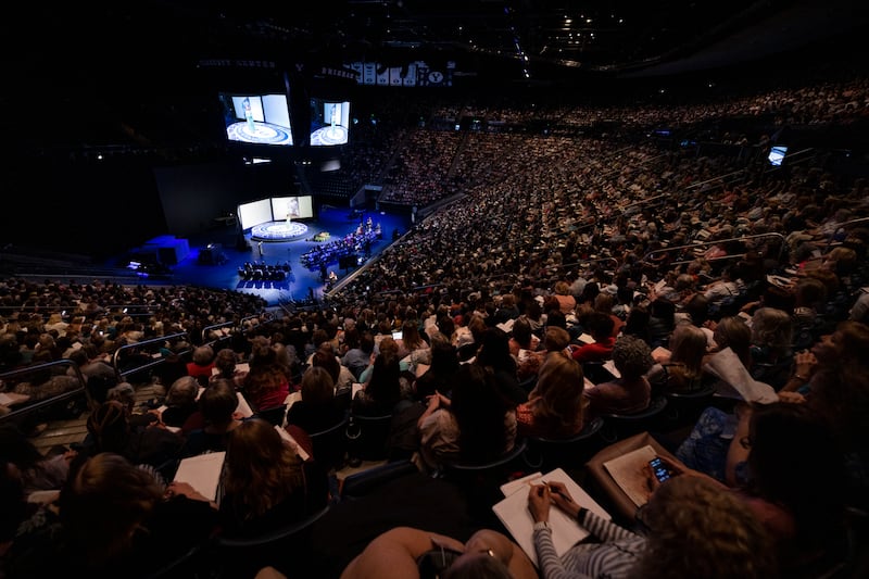 Women take notes and listen in the Marriott Center during BYU Women’s Conference, Thursday, May 4, 2023.