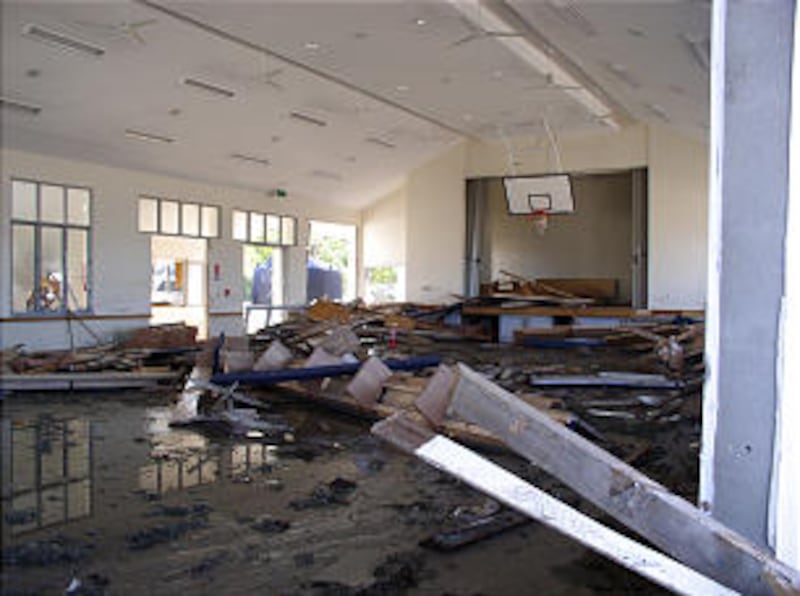Severely damaged meetinghouse in Samoa is an example of the devastation caused by an earthquake and