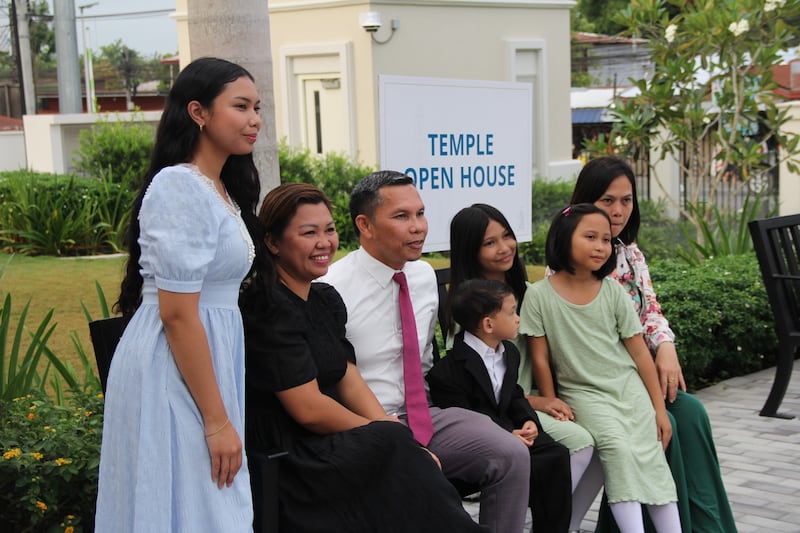 A family takes a picture outside the Davao Philippines Temple on the last day of the public open house, April 10, 2026.