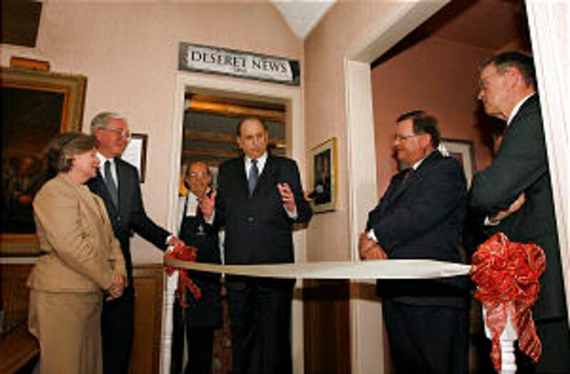 President Thomas S. Monson, center, talks with Mark Willes, president and CEO of Deseret Management