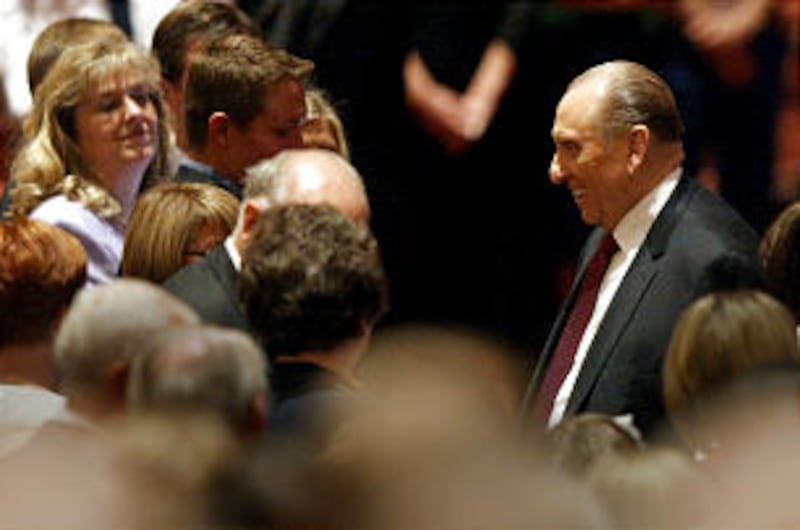 President Thomas S. Monson makes his way to his seat at Golden Days, A Celebration of Life, in honor