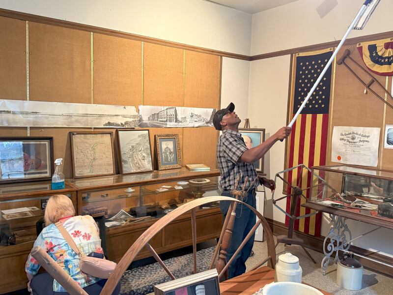 A man and a woman clean the Miller House museum in Keokuk, Iowa, on Sept. 20, 2025, as part of a service project organized in conjunction with the Nauvoo Mega Conference for Single Adults held in Nauvoo, Illinois.