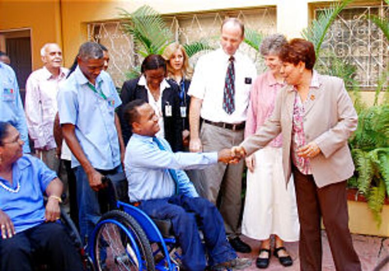 Jose "Riqui" Perez shows his gratitude for a new wheelchair provided by LDS Charities.