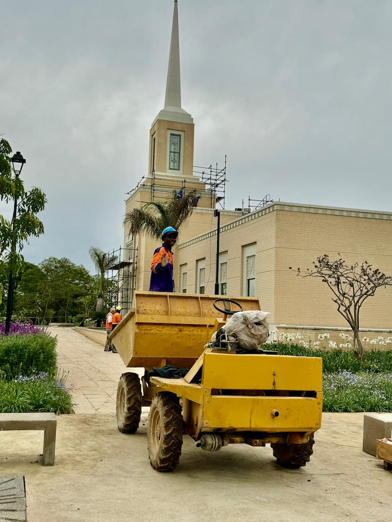Reginald Magocha, who works as a small dump driver, is photographed outside the Harare Zimbabwe Temple during its construction.