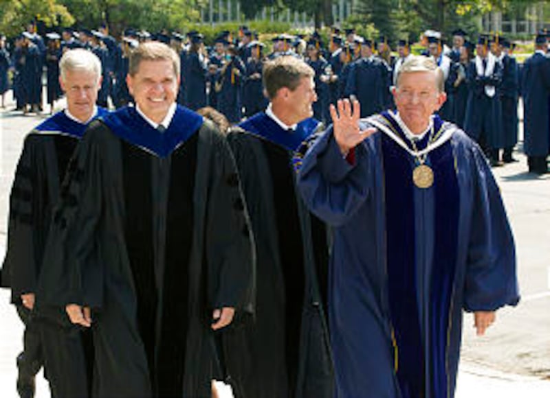 President Cecil O. Samuelson walks with Brother David L. Beck, Young Men general president, prior to