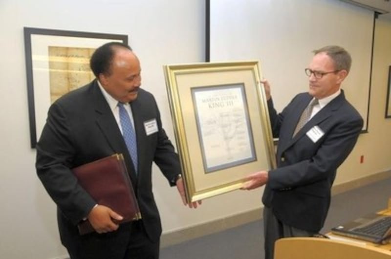 Elder David Ingram, Area Seventy, presents Martin Luther King III with the gift of the Church-compil