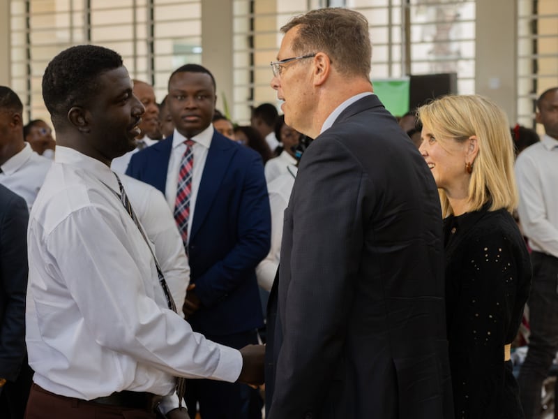 Elder Clark G. Gilbert of the Quorum of the Twelve Apostles, center, and his wife, Sister Christine Gilbert, right, greet BYU–Pathway students after a devotional in Accra, Ghana, on Friday, Aug. 28, 2026.