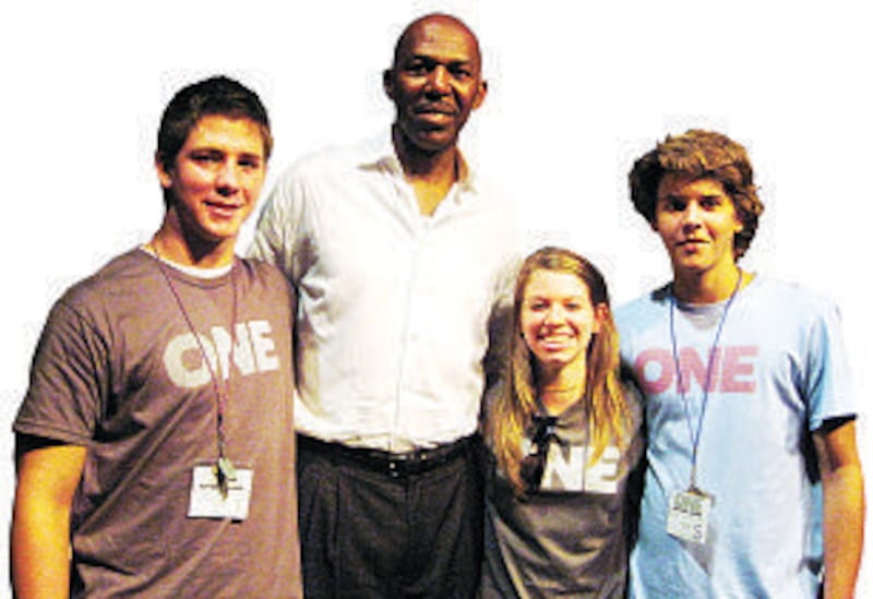 Retired professional basketball player and Church convert Thurl Bailey, second from left, meets a gr