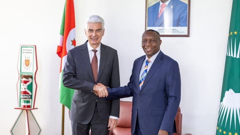 Elder Gérald Caussé takes a picture with a Burundi government official in Bujumbura, Burundi, Oct. 22, 2026.