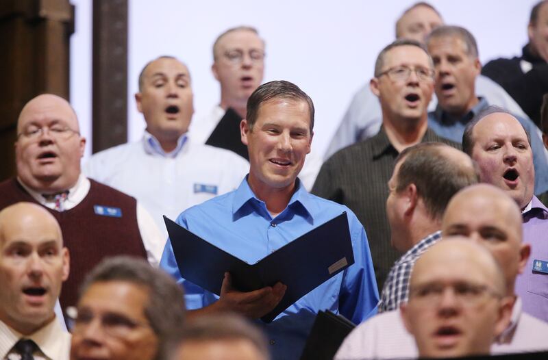 Daniel Wilson, center, sings with The Tabernacle Choir at Temple Square during a rehearsal in Salt Lake City on Thursday, April 11, 2019. Four people were selected through social media to sing with the choir.