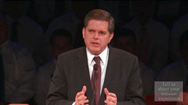 Brother David L. Beck, Young Men general president, speaks during a special priesthood anniversary t