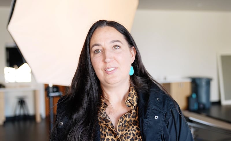 Tina Smith, a Church photographer, is interviewed for a video about the behind-the-scenes work of photographers at general conference and beyond.
