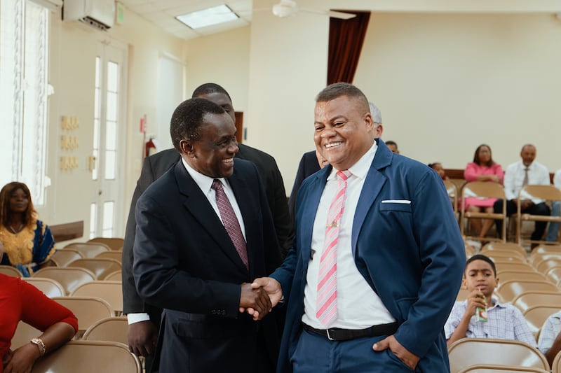 Elder Edward Dube of the Presidency of the Seventy shakes hands with a member at a special conference in Puerto Plata, Dominican Republic, on Sept. 13, 2026.
