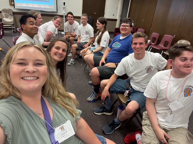 Participants of the 2025 ASL YSA conference smile for a photo in Riverside, California. The conference took place from Aug. 14 to 18, 2025.