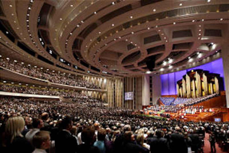 Attendees sing a congregational hymn during the Sunday afternoon session of general conference. The