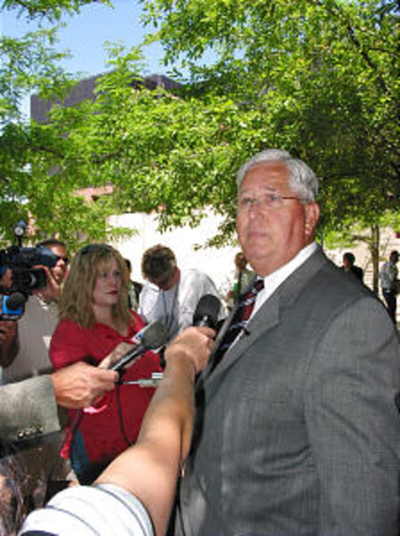 Presiding Bishop H. David Burton speaks to media on Triad plaza.