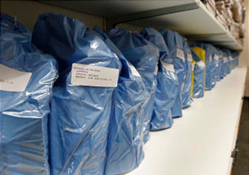 A bag of reading introductory packages are assembled for each missionary.
