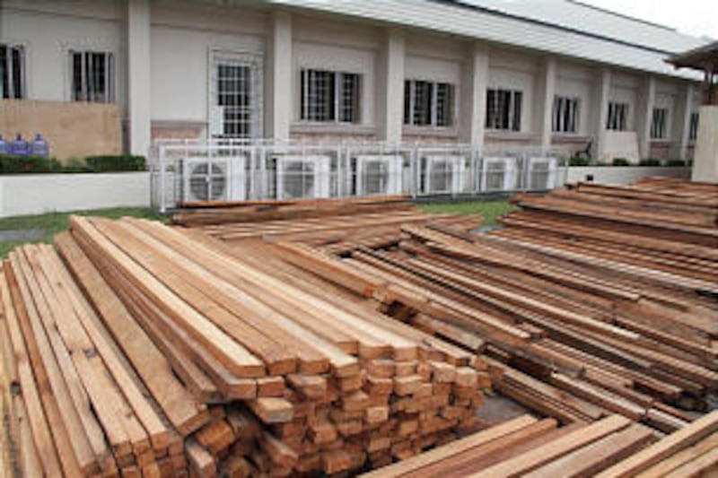 Wood pilled in in the stake center parking lot will be used to build some 3,000 new homes in areas d