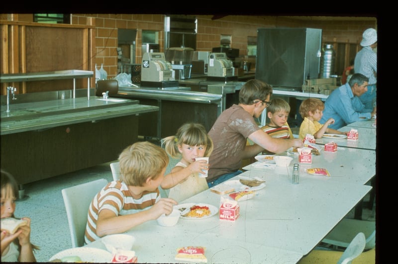 Flood victims eat a meal in the Manwaring Center on the Ricks College campus in Rexburg, Idaho. Ricks College President Henry B. Eyring opened the campus to those who lost everything in the Teton Dam flood.