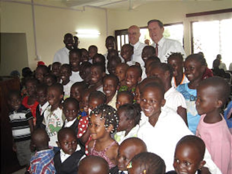 Elder Holland and Elder Clayton with children from the Bangui Branch in the Central Republic of Afri