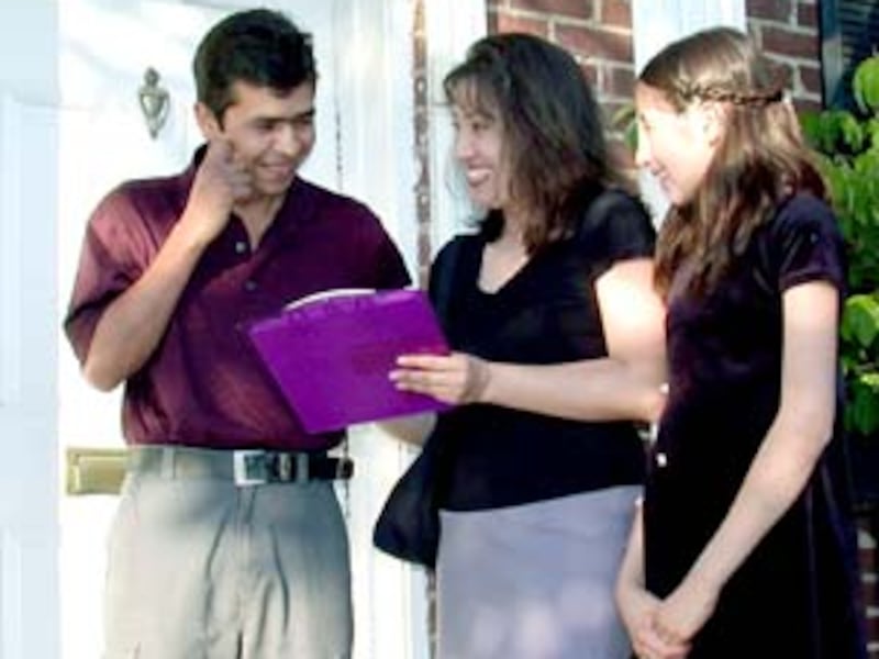 Claudia Claros and her daughter, Paola, visit young man during ward missionary effort.