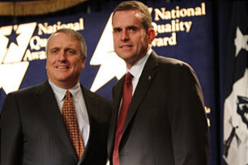 Rulon Stacey, right, stands next to Colorado Gov. Bill Ritter at the Baldrige Award ceremonies Dec.