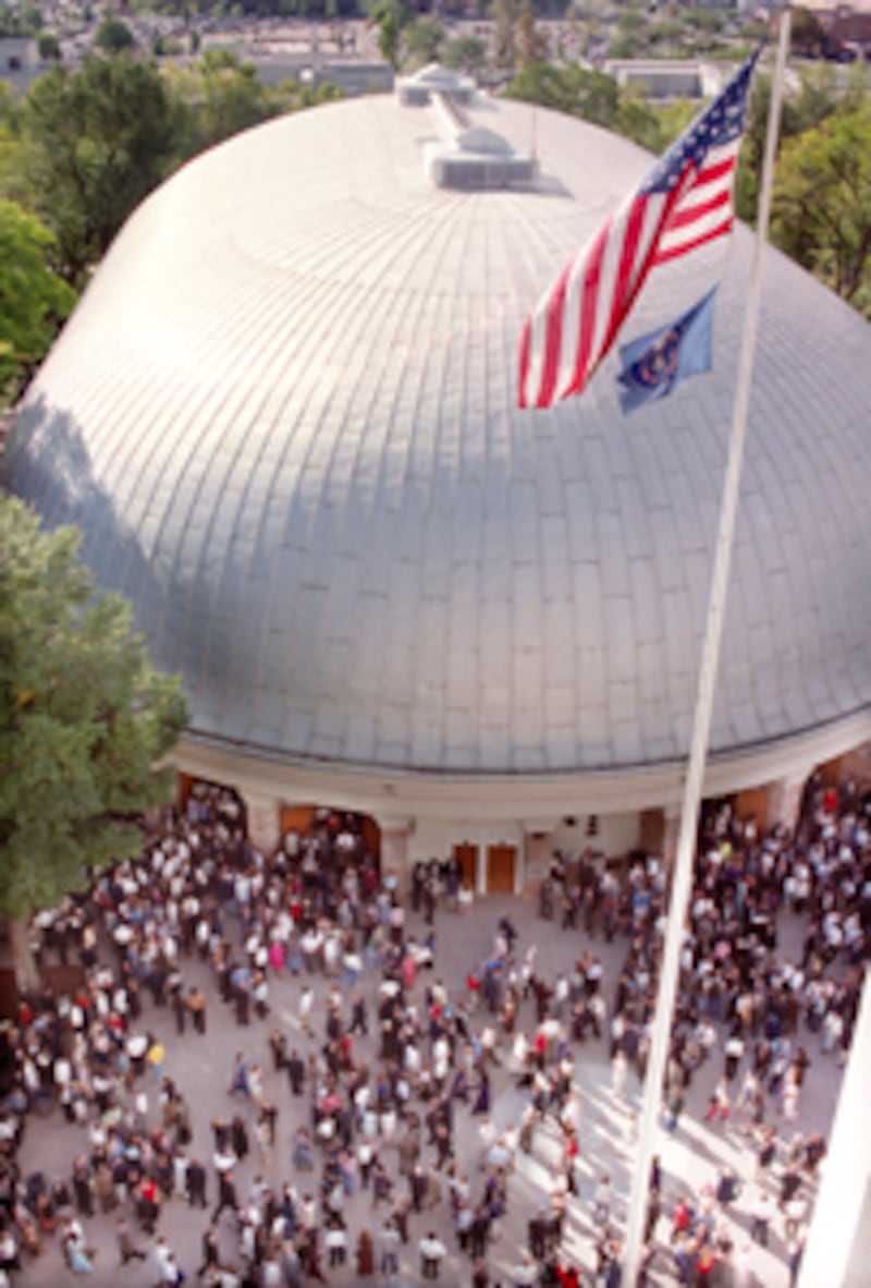 Conference attendees leave the last Lds general conference in the historic tabernacle. Allred/photo