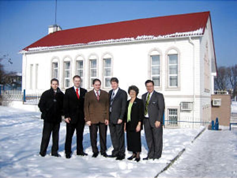 Elder Russell Hansen, Elder Adam Wardell, Aleksey Shakalov, President Dale E. Anderson, Sister Lorra