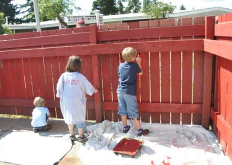 Kids paint at senior housing project.