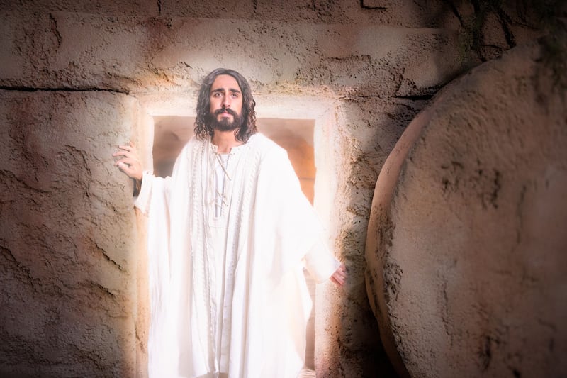 Jesus Christ emerges from the Garden Tomb.