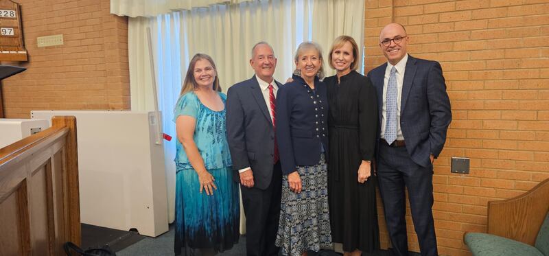 Elder Kirt L. Hodges, an Area Seventy of The Church of Jesus Christ of Latter-day Saints, and his wife, Sister Shawna Hodges, left, and Sister Amy A. Wright, first counselor in the Primary General Presidency, and her husband, Brother James Wright, right, pose for a photo with an attendee following a devotional in Nauvoo, Illinois, on Sept. 18, 2025.