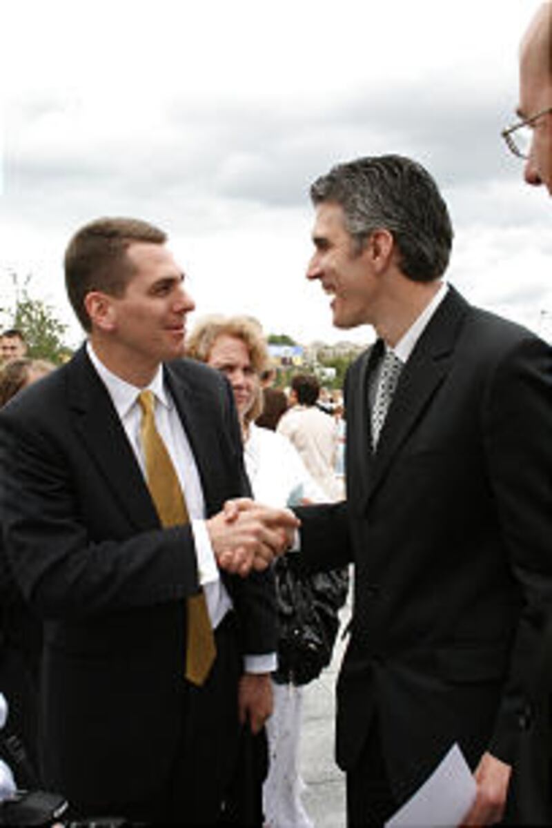At temple dedication, John Smith, left, meets Ivan Stratov, who opened missionary work in Ukraine.