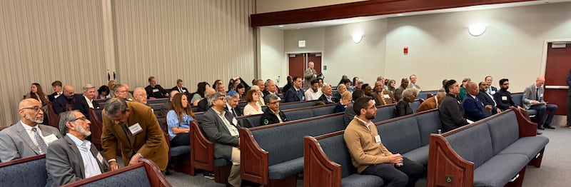 Guests sit in one of the Church's chapels in Chicago, Illinois, for an interfaith gathering on Oct. 14, 2026.