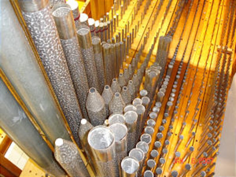 Cleaned, repaired and tuned, organ pipes in loft behind facade are among 4,200 pipes<BR> in 70 ran