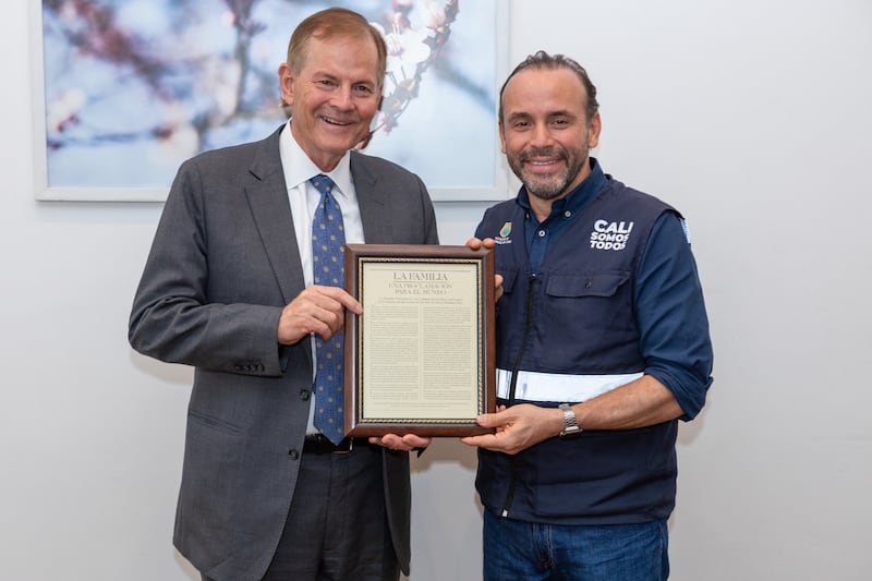Elder Gary E. Stevenson of the Quorum of the Twelve Apostles, left, presents a framed copy of “The Family: A Proclamation to the World” to Alejandro Eder, mayor of Cali, Colombia, on Monday, Aug. 24, 2026.