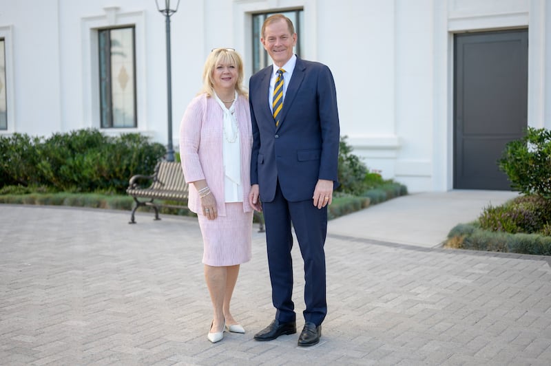 Elder Gary E. Stevenson and Sister Lesa Stevenson stand outside the Antofagasta Chile Temple.