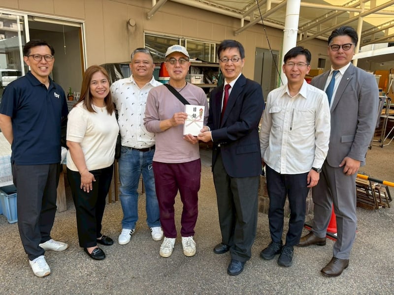 Kojiro Kitani, center, represents the Catholic Social Activities Kobe Center in Kobe, Japan, is joined by members of The Church of Jesus Christ of Latter-day Saints — including Maribeth Sumang and Renato Sumang, second and third from ledt — in a presentation of relief equipment on May 16, 2026.