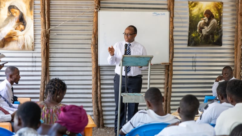Elder Johnny O. Baddoo addresses the members of Kakuma Branch in Kakuma Refugee Camp in Kenya on June 19, 2026.