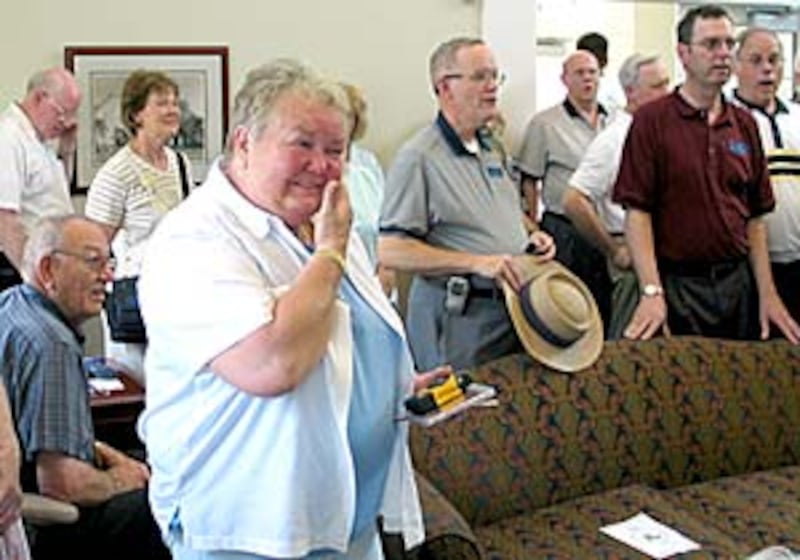 Donna Van Allen is moved by choir performance.